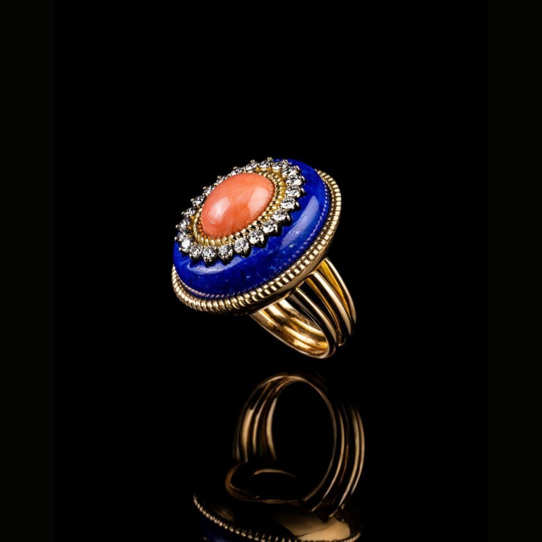 gold ring featuring lapis lazuli, cabochon cut coral and diamonds